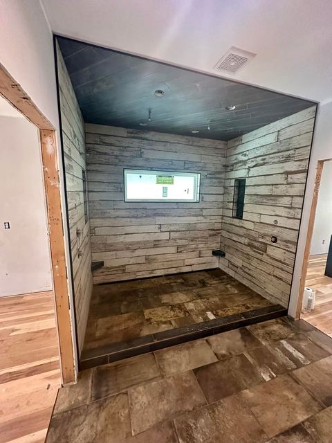 Whitewashed plank-look walk-in shower